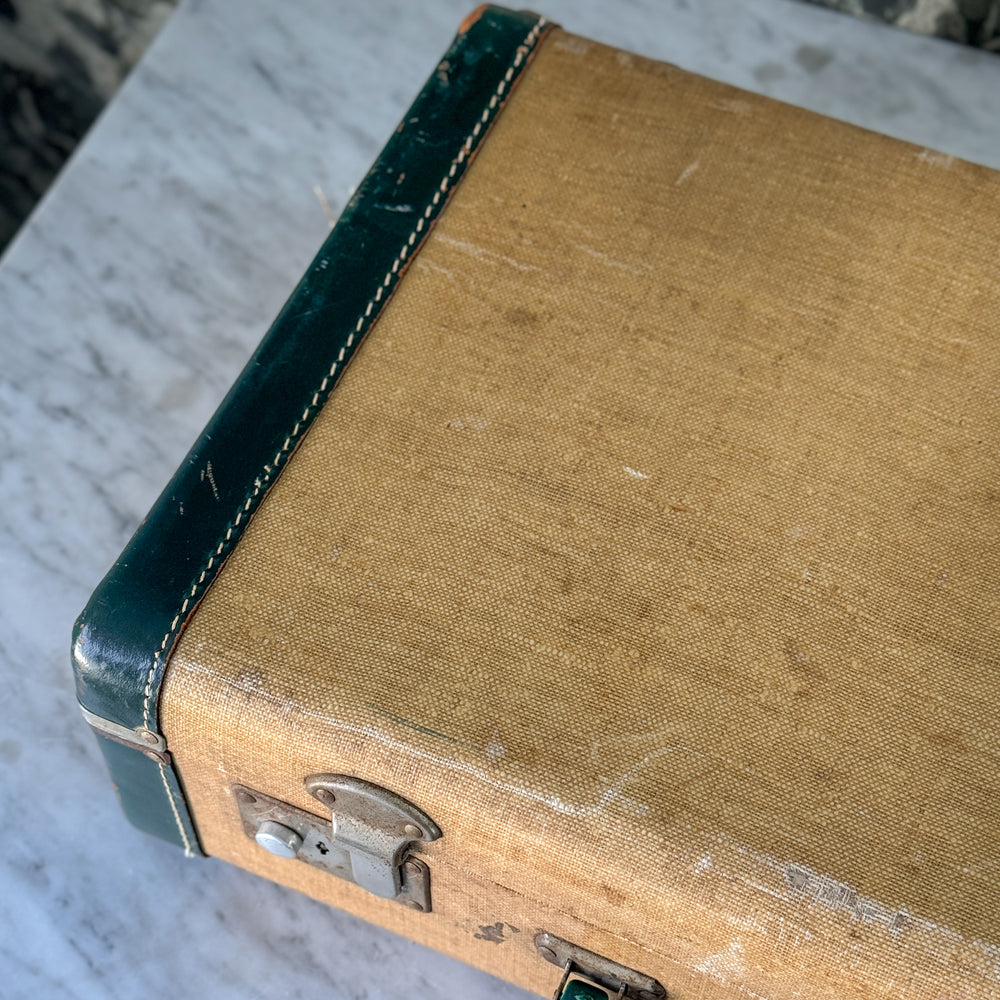 Vintage green and leather suitcase.