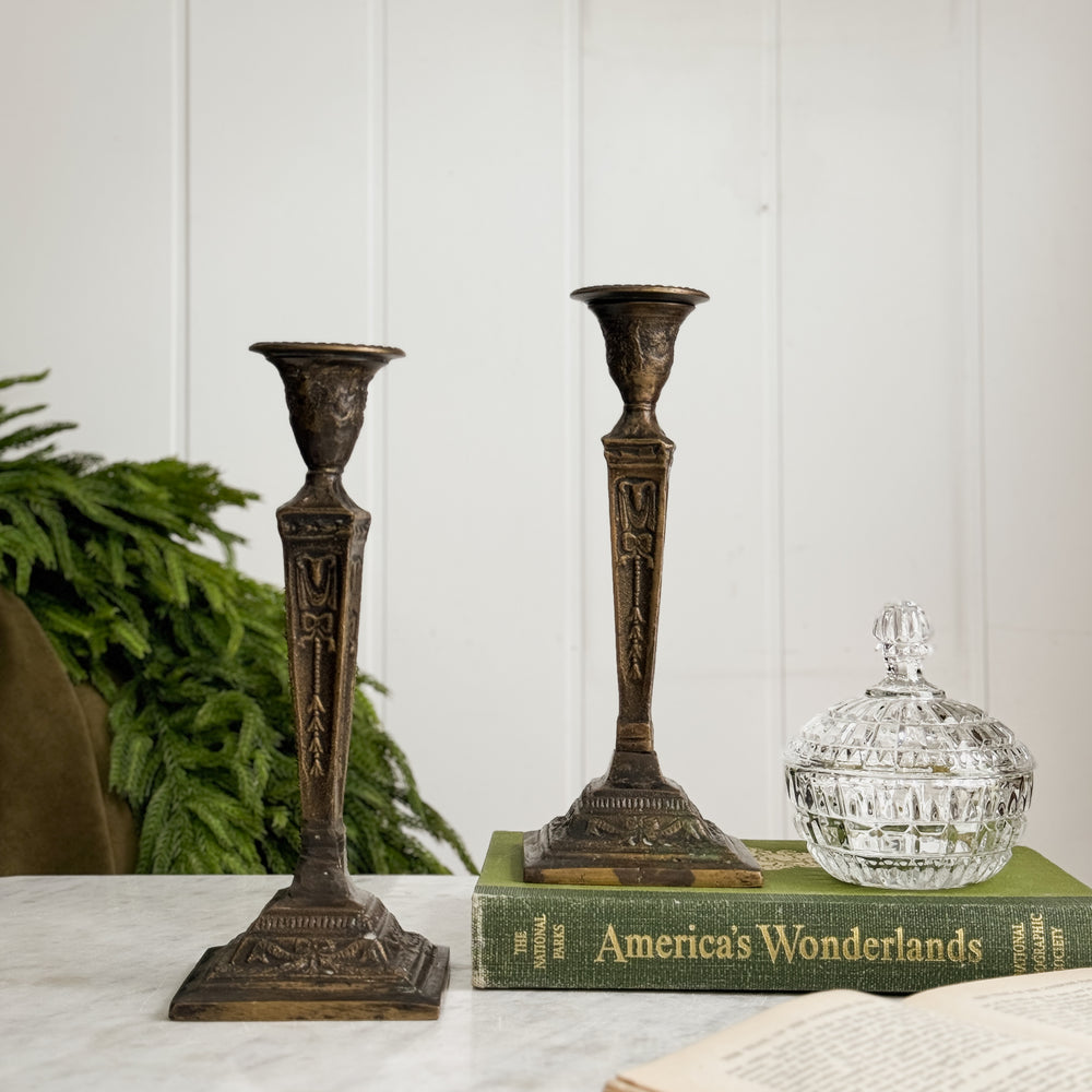 Vintage bronze taper candleholder pair.