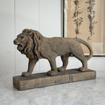 Aged brown Concrete Lion Statue.