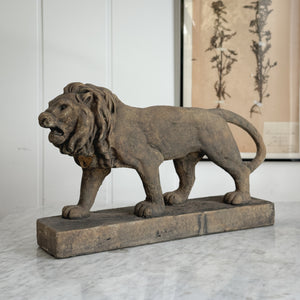 Aged brown Concrete Lion Statue.