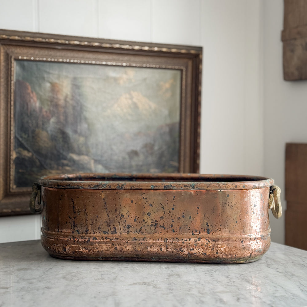 Vintage copper handled planter.
