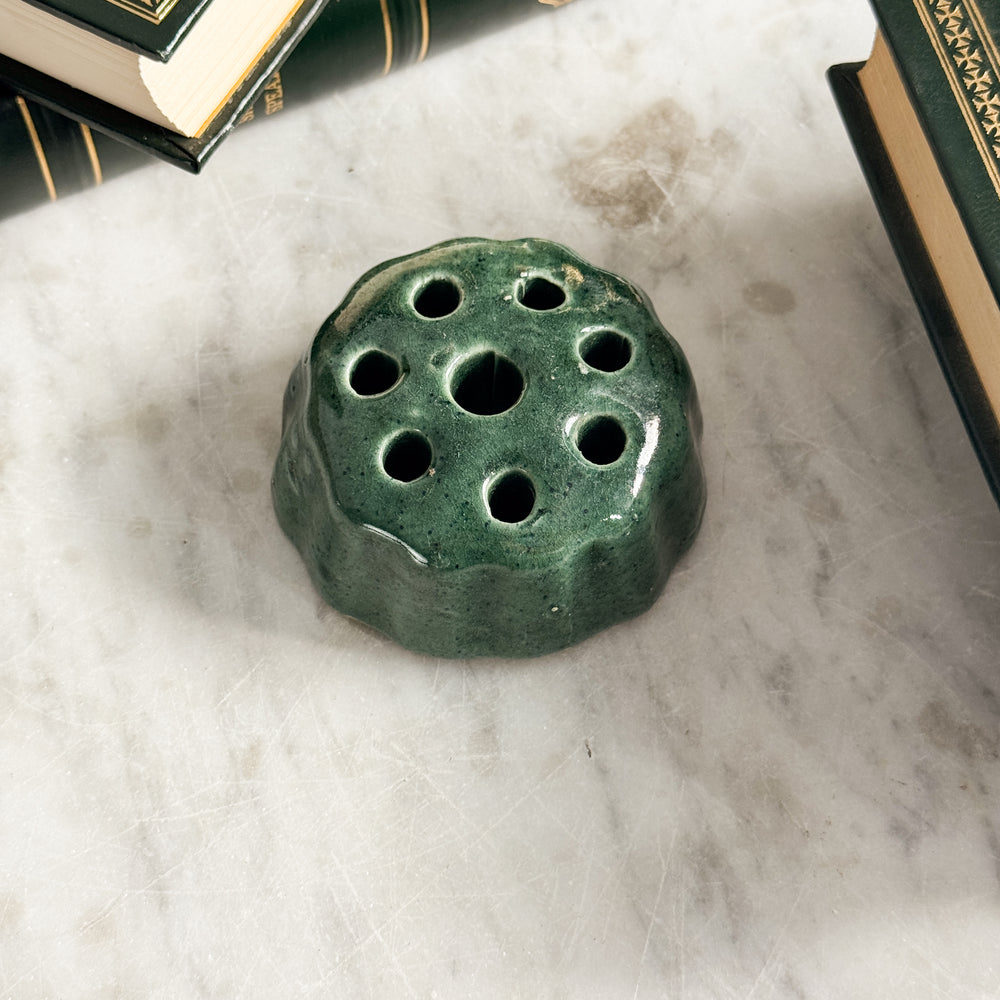 Vintage green pottery flower frog.
