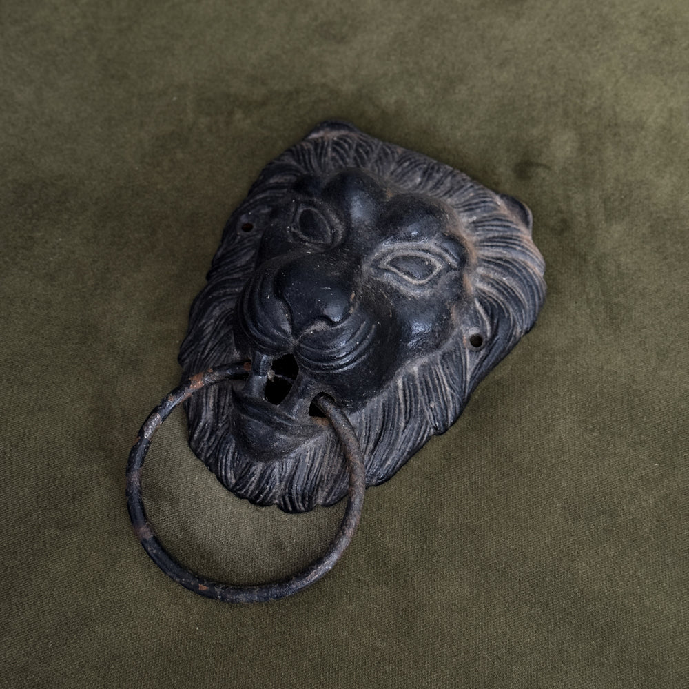 Vintage black lion door knocker.