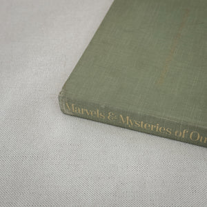 Vintage green Marvels & Mysteries book.