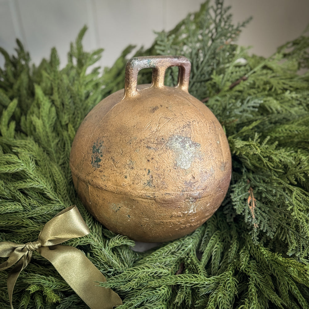 Vintage gold metal fishing float.