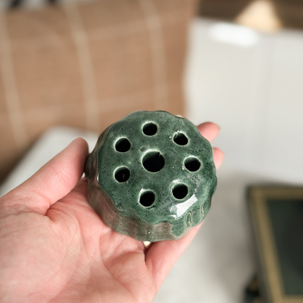 Vintage green pottery flower frog.