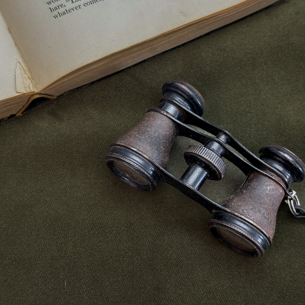 Vintage black strap opera glasses.