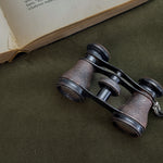 Vintage black strap opera glasses.