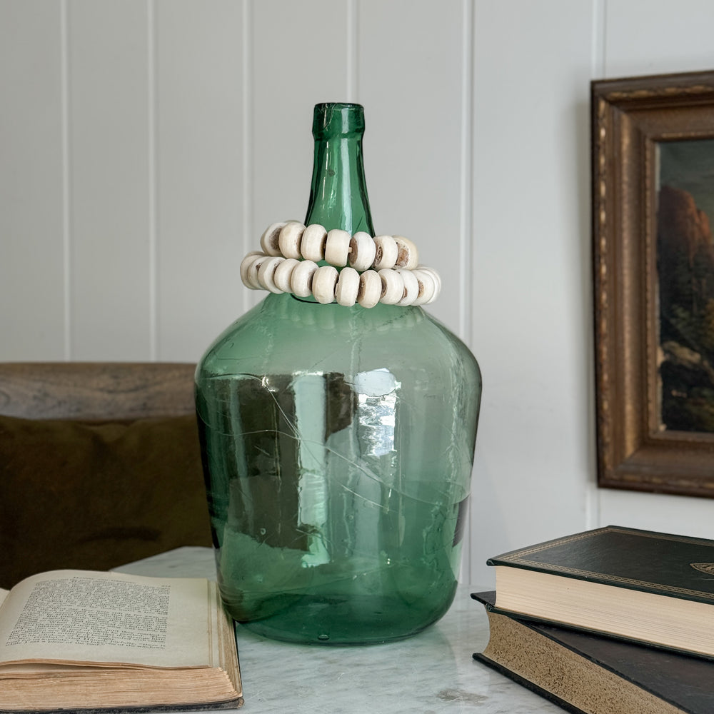 Vintage green European demijohn.