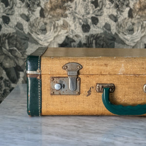 Vintage green and leather suitcase.