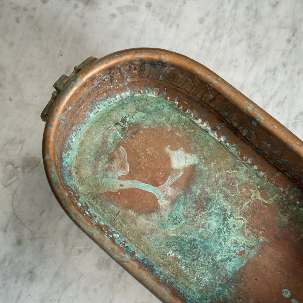 Vintage copper handled planter.
