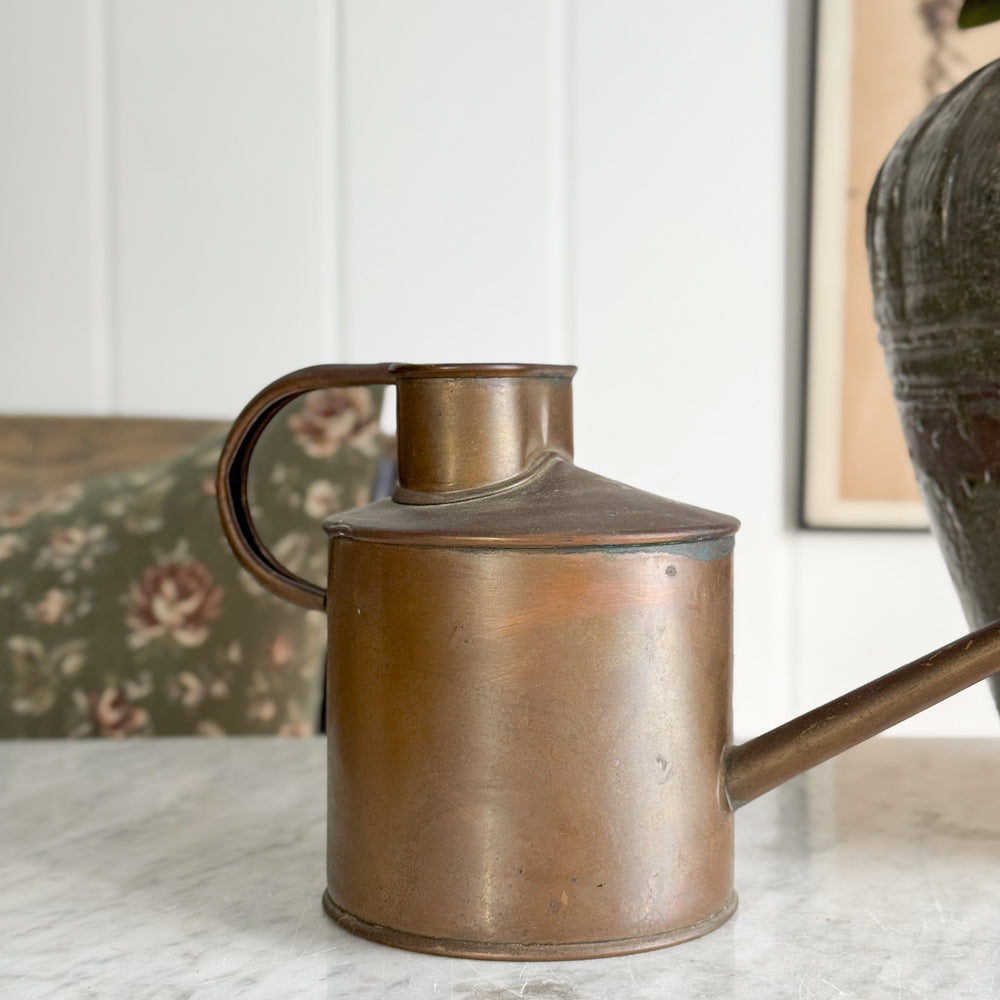Vintage copper English watering can.