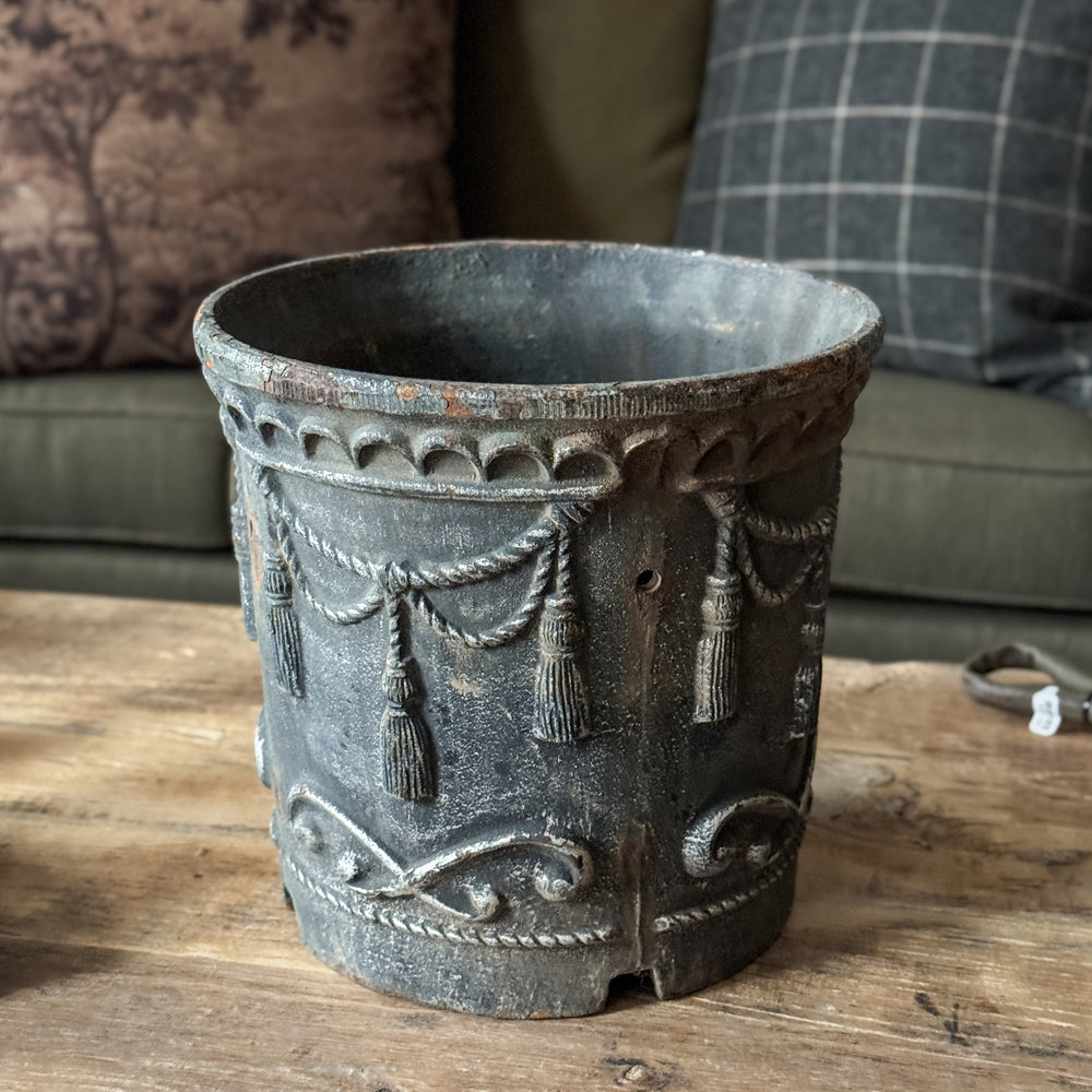 Vintage cast iron tassel planter.