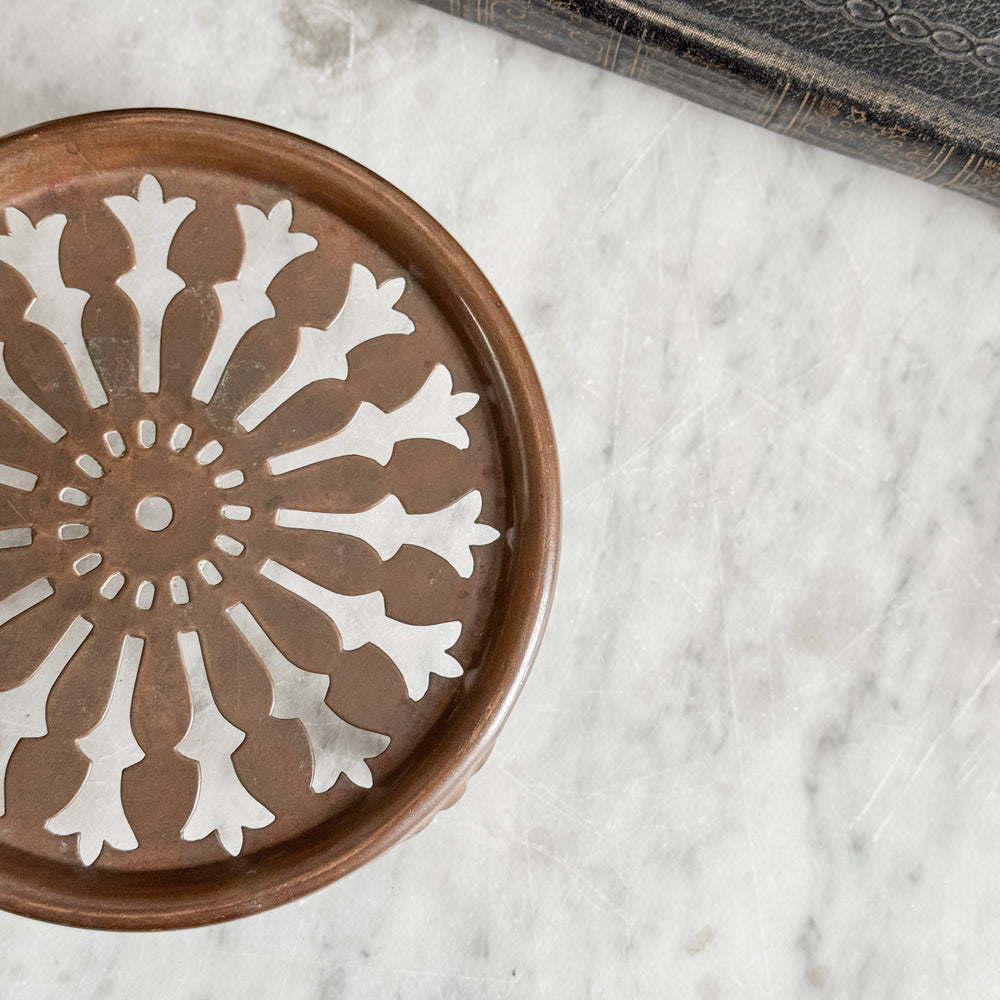 Vintage copper trivet.