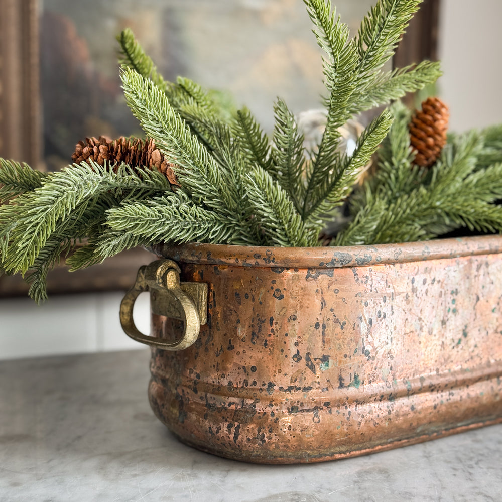 Vintage copper handled planter.