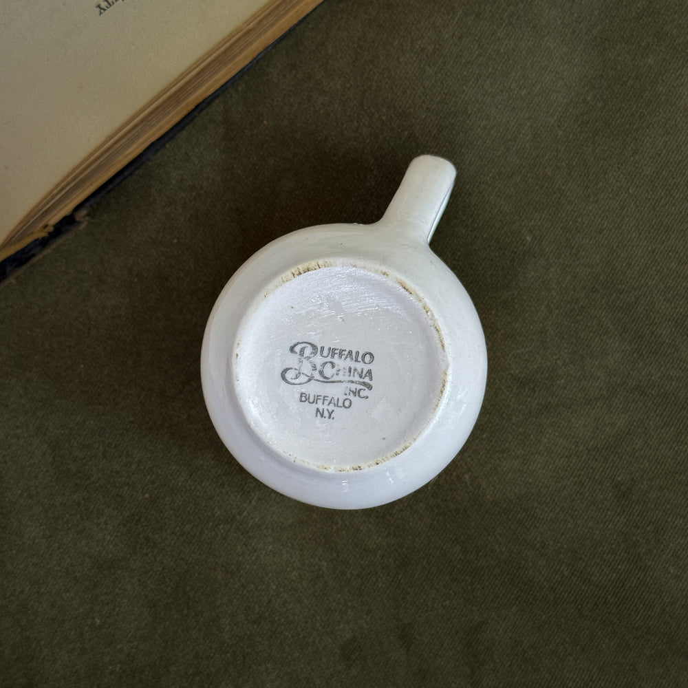 Vintage buffalo gold rim creamer