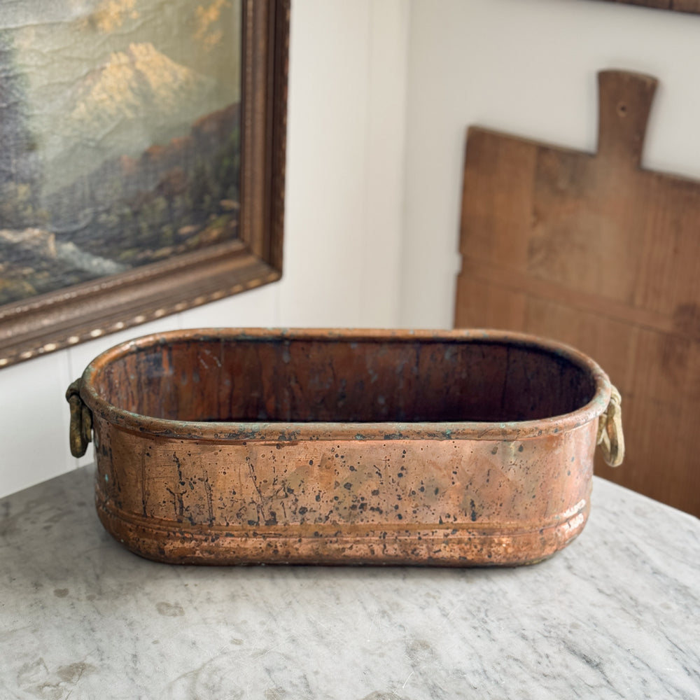 Vintage copper handled planter.
