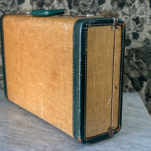 Vintage green and leather suitcase.