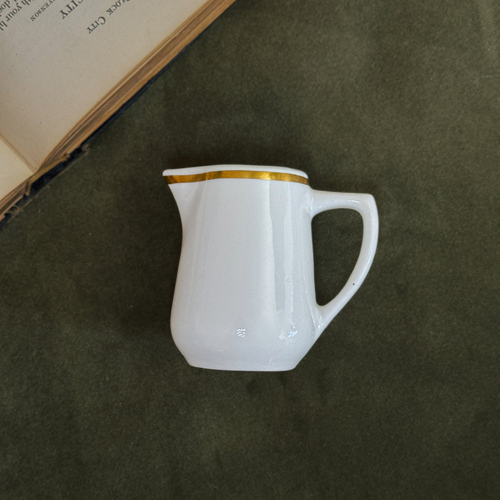 Vintage buffalo gold rim creamer