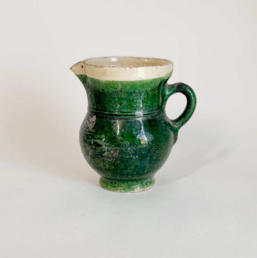 Vintage green pottery pitcher