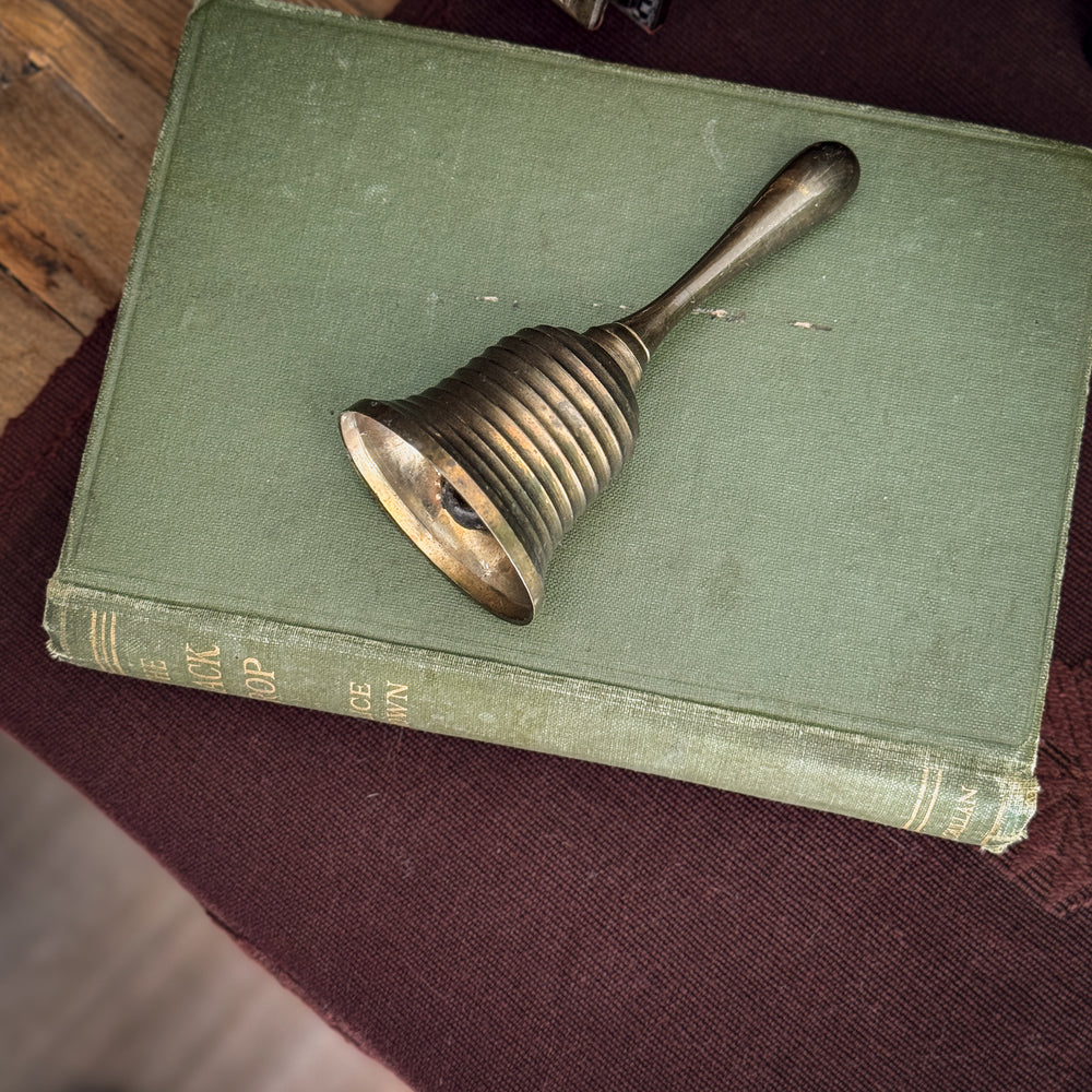 Vintage striped brass bell.