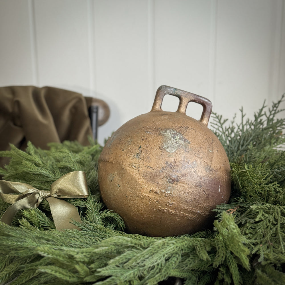 Vintage gold metal fishing float.
