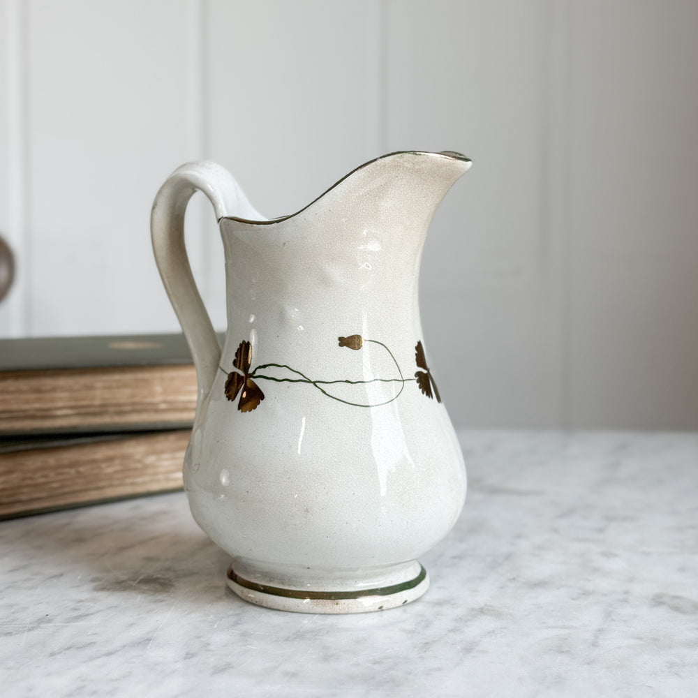 Antique ironstone green and gold pitcher.