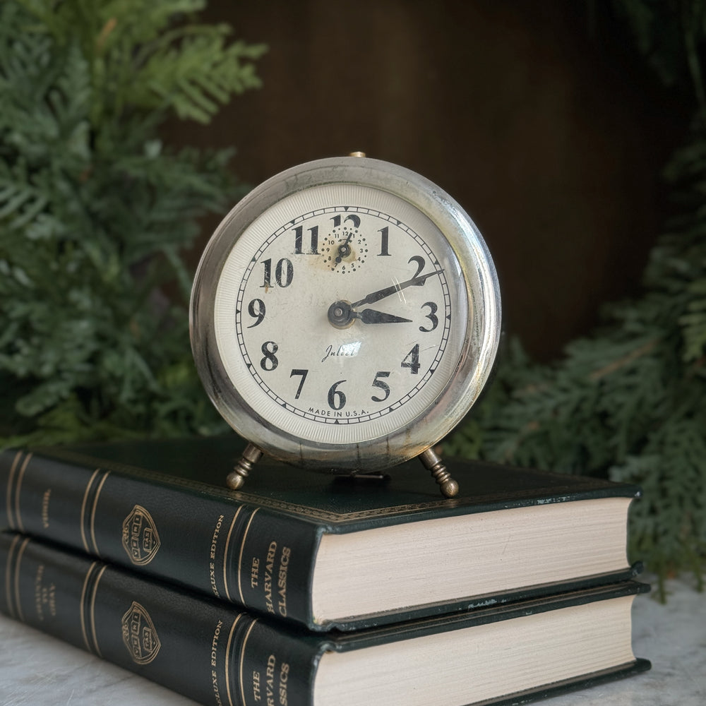 Vintage silver footed Juliet clock.