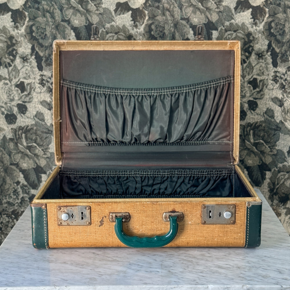 Vintage green and leather suitcase.