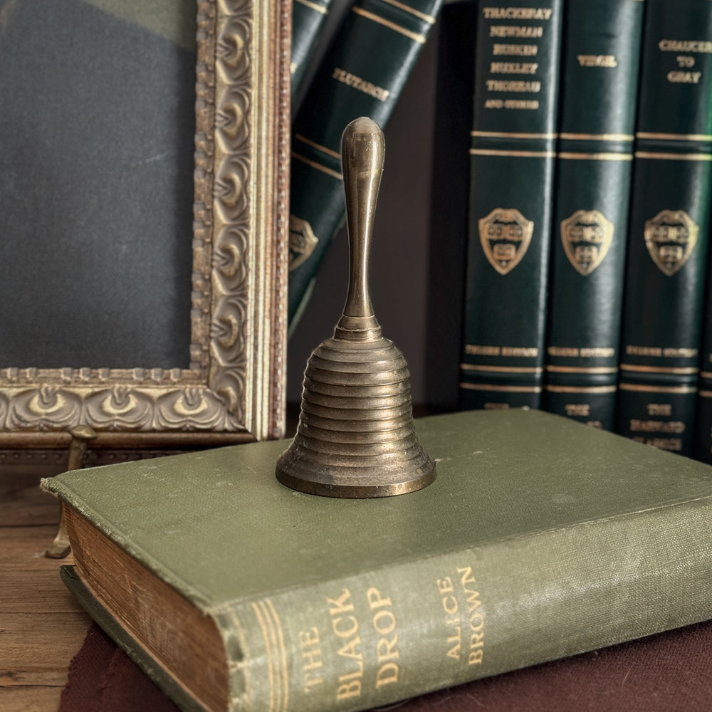 Vintage striped brass bell.