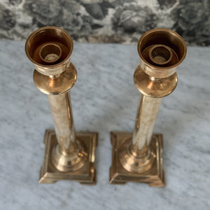 Vintage large brass taper pair.