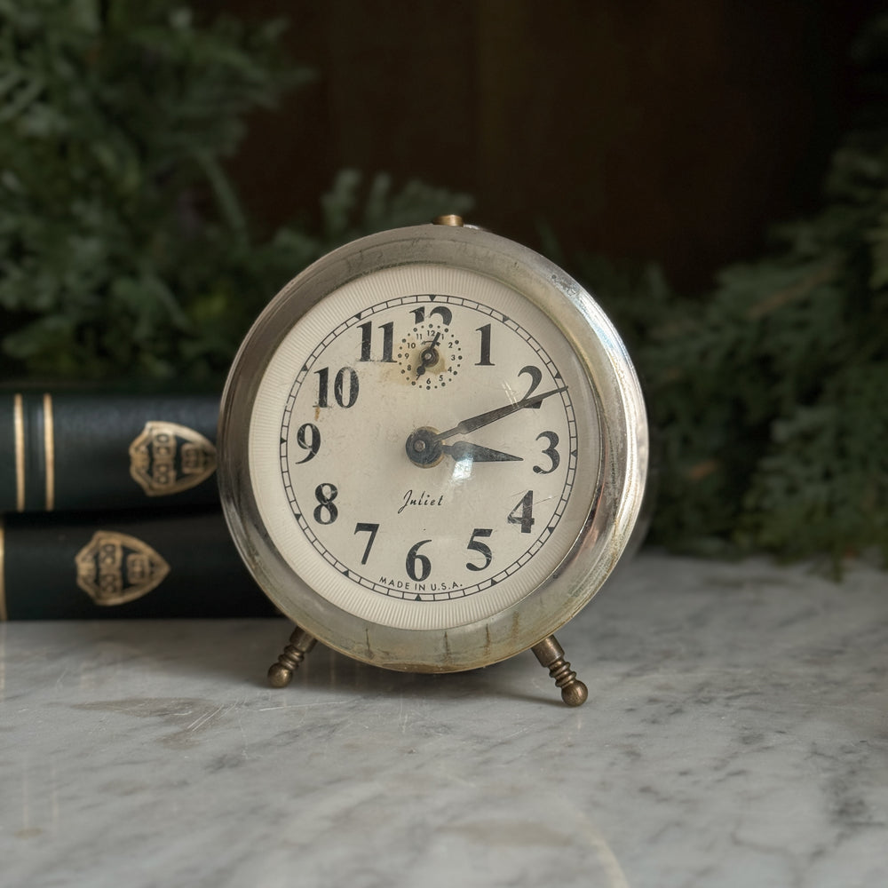 Vintage silver footed Juliet clock.